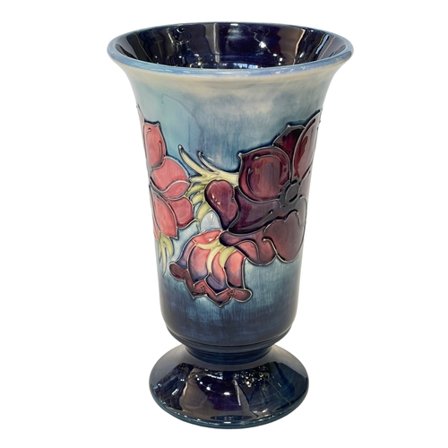 189 - Large William Moorcroft Pottery vase decorated with anemone on blue ground, 28.5cm.