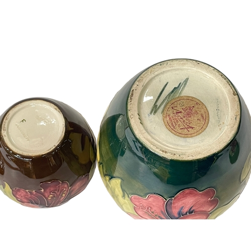 193 - William Moorcroft ginger jar decorated with hibiscus on green ground, signed with paper label to bas... 