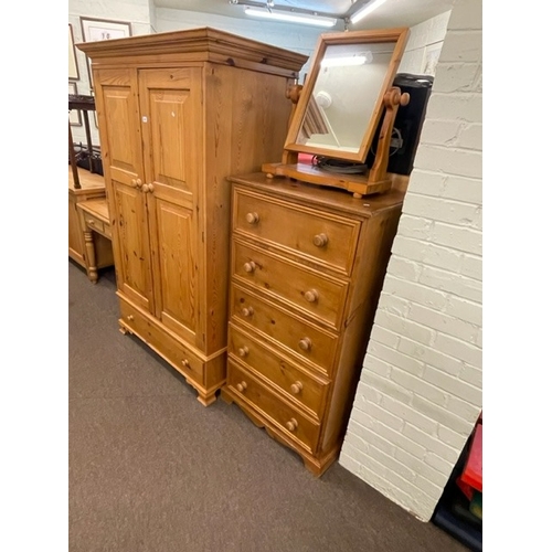 245 - Four piece pine bedroom suite comprising two door wardrobe with base drawer, five drawer chest, dres... 