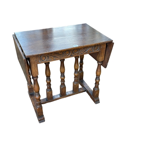 284 - Carved jointed oak drop leaf occasional table, 60cm by 64cm by 40cm (leaves down).