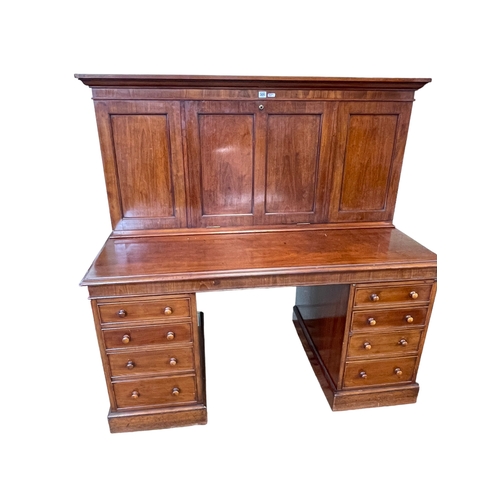 305 - Victorian mahogany pedestal desk, the upper section having fall front writing surface and two doors ... 