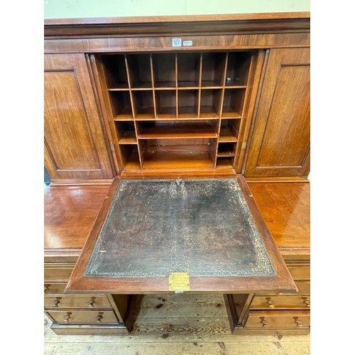 305 - Victorian mahogany pedestal desk, the upper section having fall front writing surface and two doors ... 