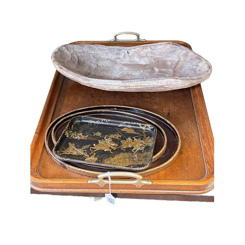 125 - Three black lacquer trays, large wooden tray and a bread bowl.