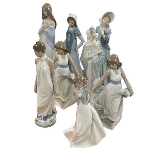 14 - Eight large Nao figures including two Ladies with Bonnets, Floral Beauty and Walking on Air.