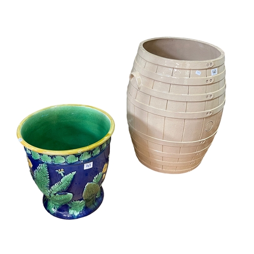 143 - Majolica style jardiniere and a glazed pottery barrel.