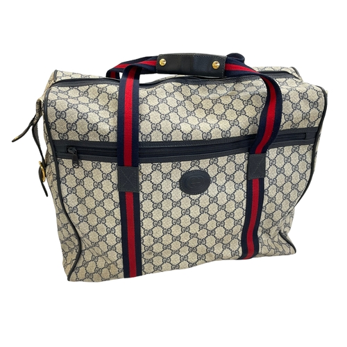 145 - Gucci Grey Supreme monogrammed holdall bag.