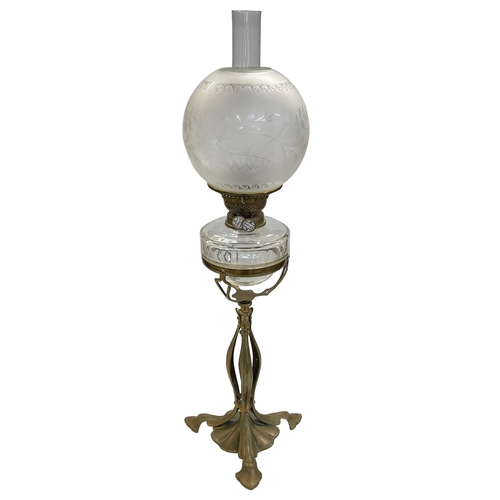 154 - Art Nouveau oil lamp with etched shade, 75cm high.