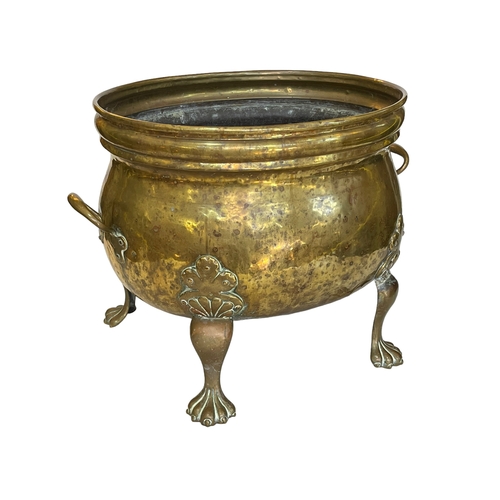 158 - Large brass log bin on four legs, 40cm high.