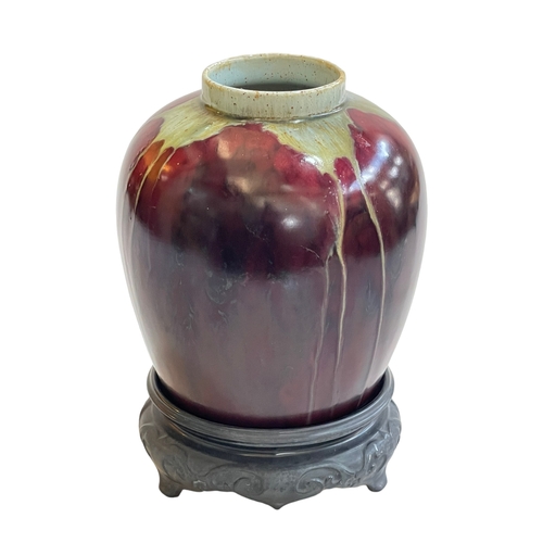 164 - Chinese pottery vase on wood stand with green and red slip glaze design, 24cm including stand.