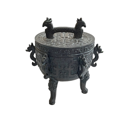 166 - Oriental style three legged metal vessel with lid.