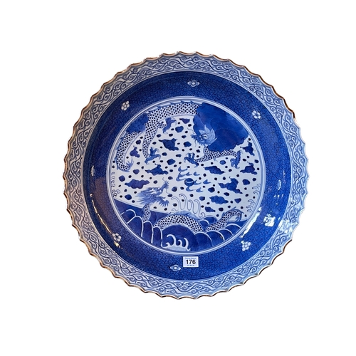 176 - Large Chinese blue and white charger dish decorated with dragons, six character mark to base, Qing D... 