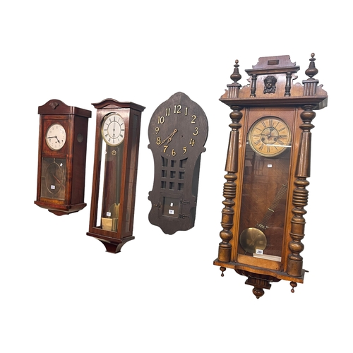 288 - Victorian walnut cased Vienna wall clock, two mahogany wall clocks and oak wall clock (4).