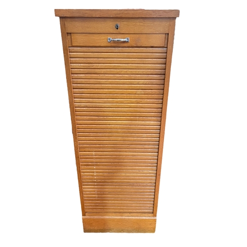 315 - Gold oak tambour front filing cabinet with key, 119.5cm by 46.5cm by 41cm.