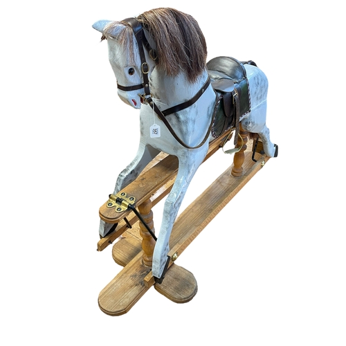 357 - Sponge painted grey wooden rocking horse on safety stand, 105cm by 134cm.