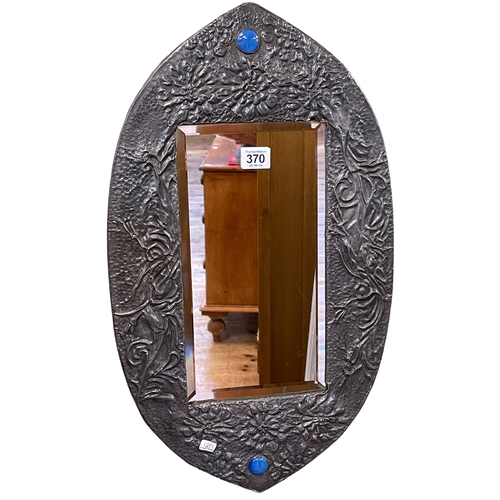 370 - Arts & Crafts pewter framed bevelled wall mirror with two inset circular cabochons, 57cm by 33cm.