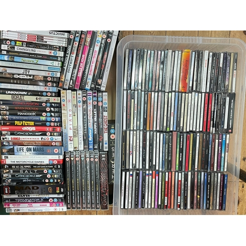 38 - Four boxes of DVD's and CD's.