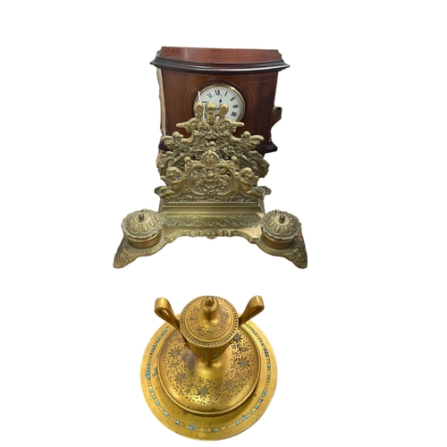 43 - Ornate brass desk stand with inkwells, mahogany inlaid mantel clock and a gilt metal inlaid Oriental... 
