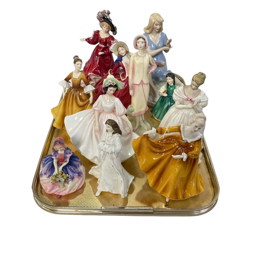 21 - Twelve Royal Doulton figures including Patricia and Summer Rose.