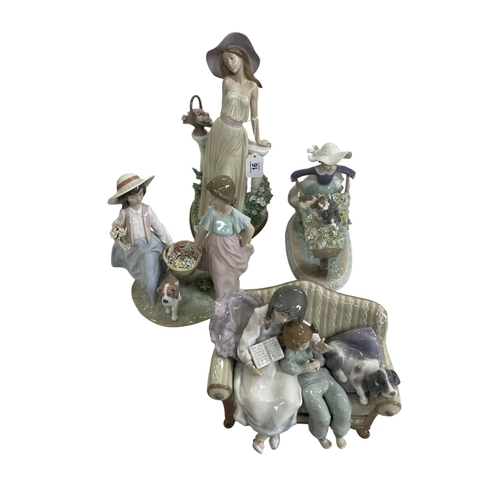 16 - Four large Lladro groups.