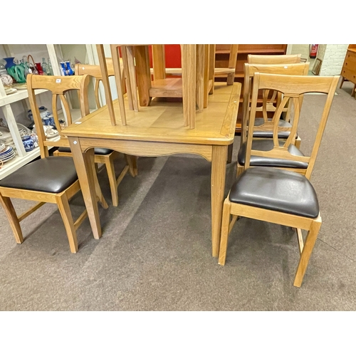 Light oak rectangular extending dining table with integral leaf and set ...