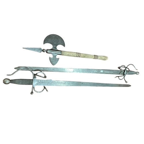 104 - Two reproduction swords (Spanish?) and an axe.