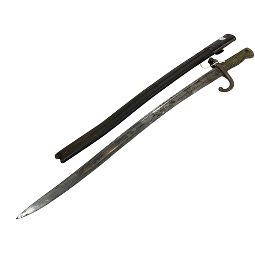 108 - Military bayonet and scabbard marked 50036 (number is worn). Blade is 57cm.