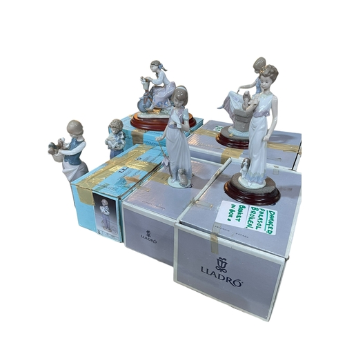 11 - Six Lladro figures including Travelling in Style, with five boxes.