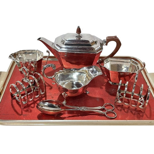 5 - 1930's silver plated tea set, pair toast racks, sauce boat and servers.