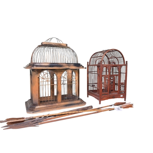 65 - Two ornate bird cages and African spear and arrows.