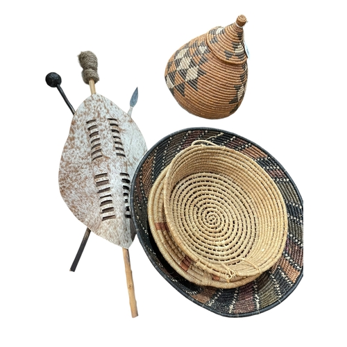 68 - Large Zulu dish, Zulu lidded basket and stand, two wicker bowls and Zulu tribal shield.