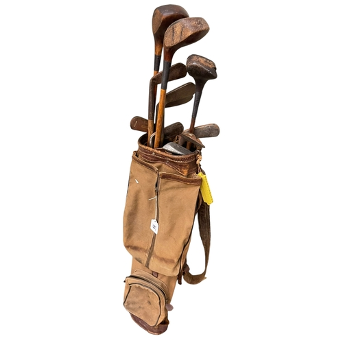 94 - Collection of eleven vintage hickory shafted golf clubs and bag.