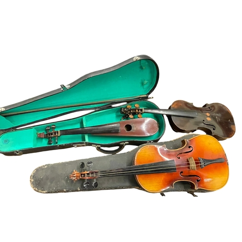 138 - Two violins (one with case and bow) together with another.