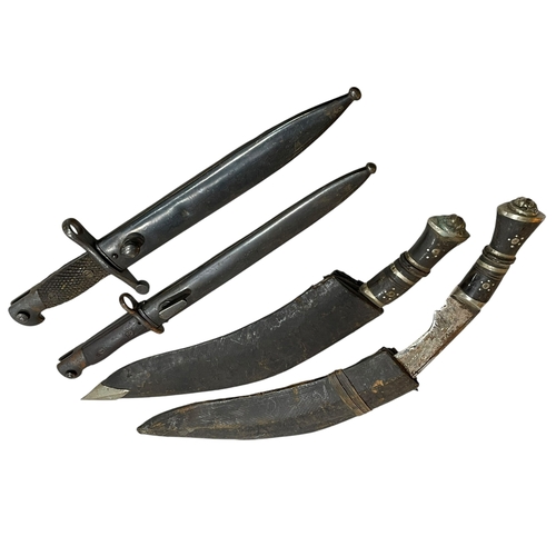 168 - Two kukri knifes, Islamic? bayonet and a Spanish bayonet marked 'Toledo' 2047 with scabbard.