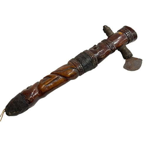 210 - Carved wood tribal axe.