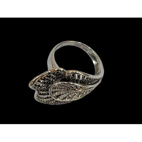 217 - Black and white diamond 18 carat white gold fancy design ring, diamond 1.03 carats, size O.