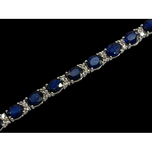 218 - Sapphire and diamond tennis bracelet comprising of 26 oval sapphires, 11.60 carats divided by pairs ... 