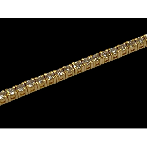 221 - Diamond tennis bracelet comprising over 70 diamonds set in 18 carat yellow gold, diamond 3 carats.