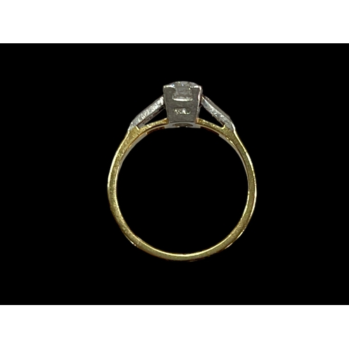 222 - 18 carat yellow gold 0.50 carat solitaire diamond ring set with baguette cut diamond shoulders, size... 