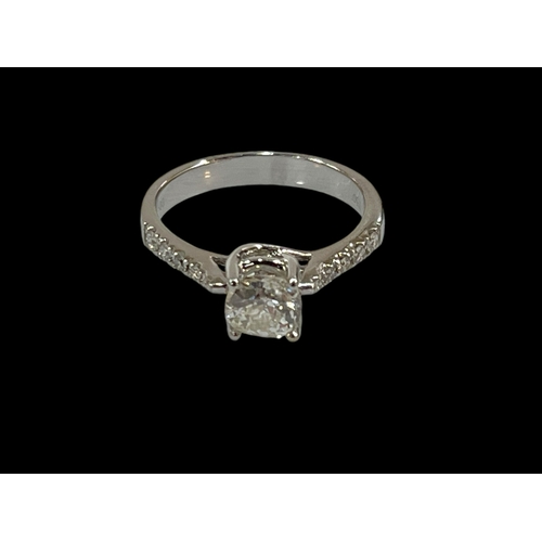 223 - 18 carat white gold 70 point centre diamond ring set with five graduated diamonds to each shoulder, ... 