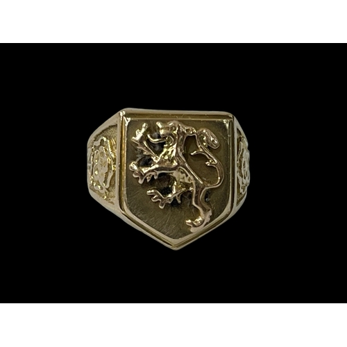 252 - 9 carat gold Gents ring with lion design and rose design to the shoulders, size Q.