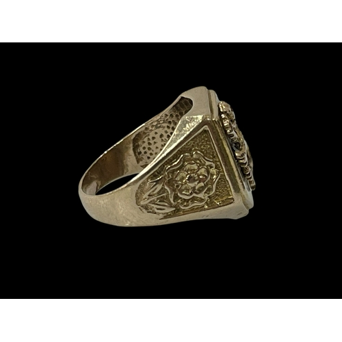 252 - 9 carat gold Gents ring with lion design and rose design to the shoulders, size Q.