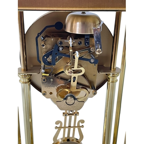 262 - Rapport brass four pillar mantel clock with enamel dial.