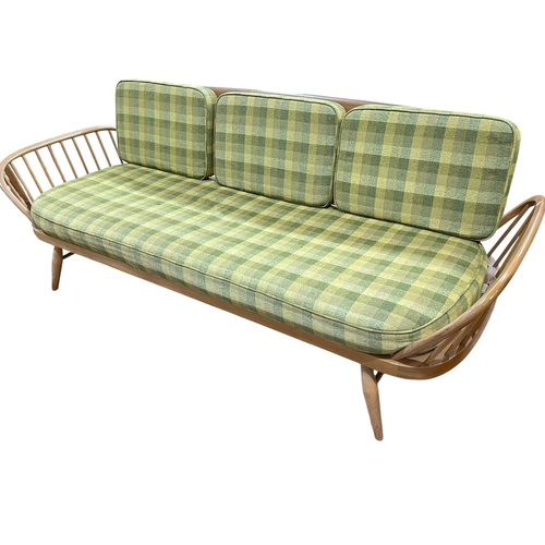 413 - Vintage Ercol Windsor three piece lounge suite comprising Studio couch, rocking chair and easy chair... 