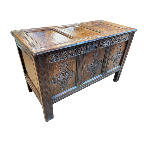 430 - Antique carved and jointed oak three panel front coffer, 72cm by 117cm by 56cm.