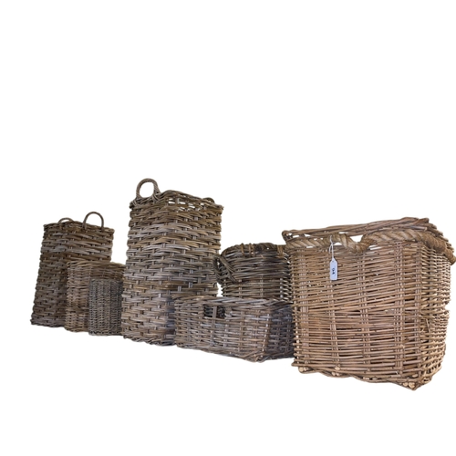 94 - Seven wicker baskets.