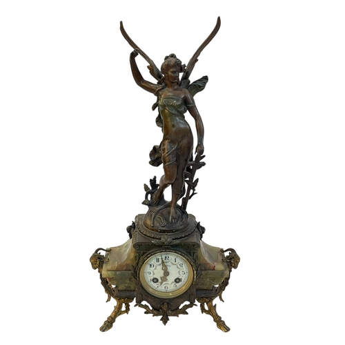 163 - Ornate spelter and onyx mantel clock mounted with winged maiden.