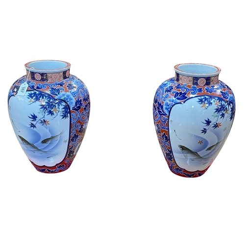 167 - Pair of large Japanese vases with panels of fish and foliage with red and blue foliate design ground... 