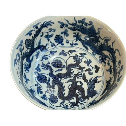 170 - Chinese blue and white dragon bowl, four character marks to base, 18cm diameter.