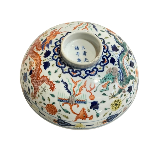 176 - Chinese circular footed bowl decorated with dragons, six character mark to base, 18.5cm.