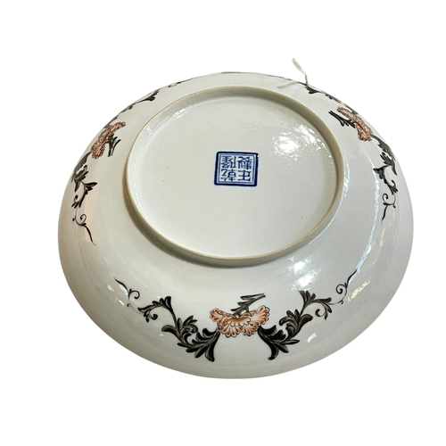 180 - Chinese saucer dish with figures and horses in outdoor scene, blue seal mark, 17.5cm.